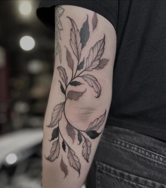 Medium Blackwork Leaves Tattoo on Women Elbow by @eleanoronyx