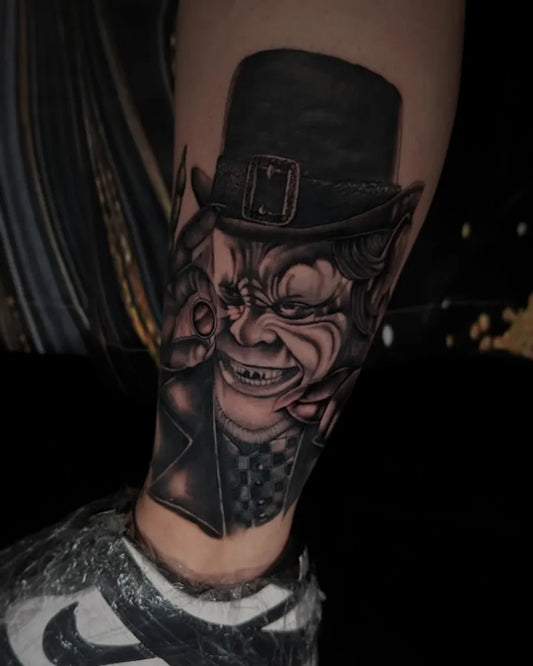 Medium Blackwork Leprechaun Horror Tattoo on Men Leg by @inkbychico