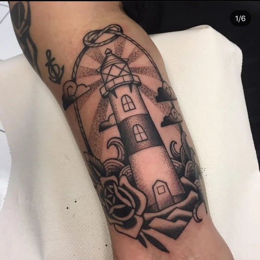 Medium Blackwork Lighthouse Rose Anchor Tattoo on Men Arm by @inverinktattoo