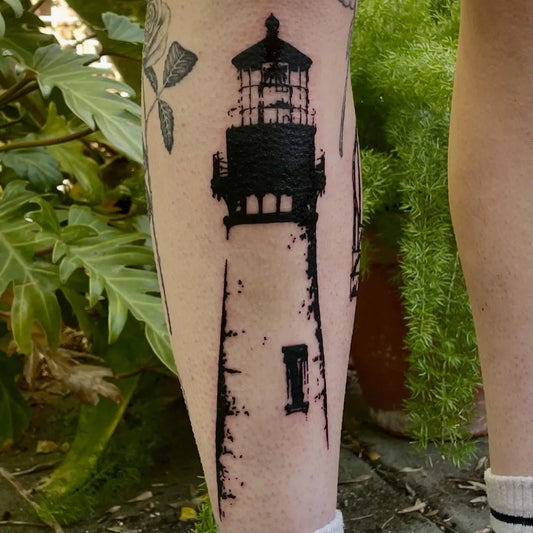 Medium Blackwork Lighthouse Tattoo on Women Leg by @liquorice_ink