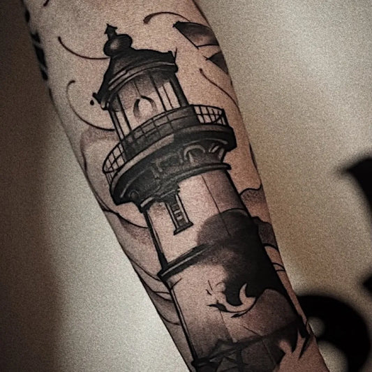 Medium Blackwork Lighthouse with Waves Tattoo on Men Arm by @chooklya