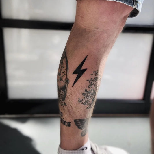 Medium Blackwork Lightning Bolt Skull and Banner Tattoo on Men Leg by @melvinfl