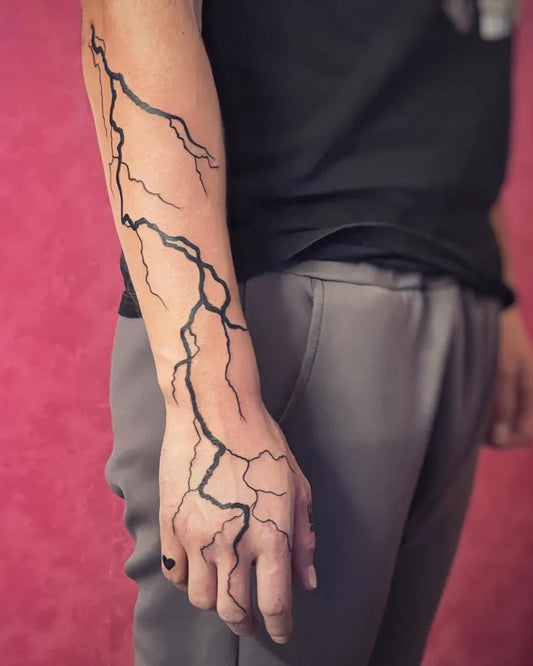 Medium Blackwork Lightning Bolt Tattoo on Men Arm by @bambiink_tattoo