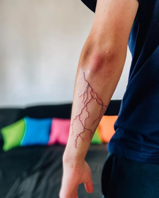 Medium Blackwork Lightning Bolt Tattoo on Men Arm by @terapia_linkou