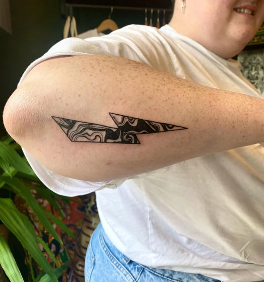 Medium Blackwork Lightning Bolt Tattoo on Women Arm by @bexwilkestattoo
