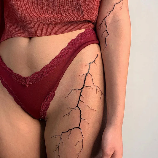 Medium Blackwork Lightning Bolt Tattoo on Women Thigh by @badlystuffedanimal
