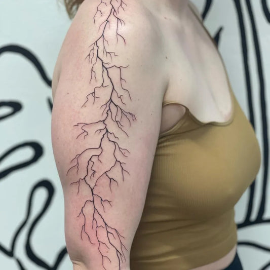 Medium Blackwork Lightning Bolts Tattoo on Women Arm by @shoresidetattoo
