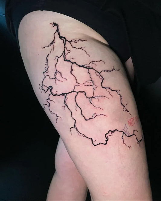 Medium Blackwork Lightning Bolts Tattoo on Women Thigh by @fynn_tattooz