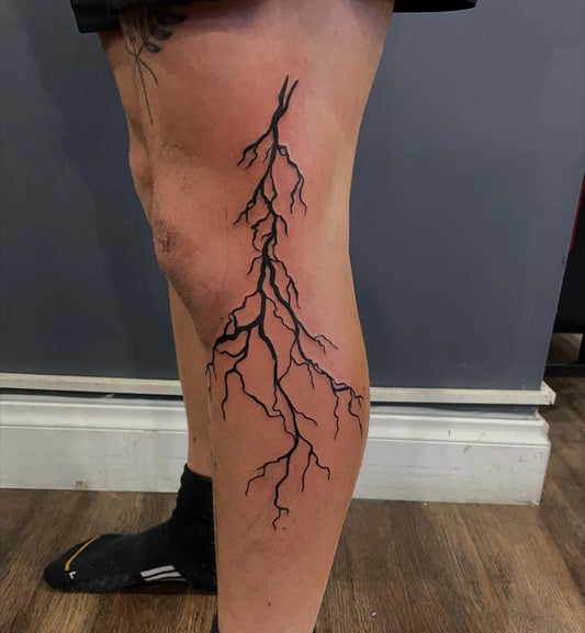 Medium Blackwork Lightning Bolts Tattoo on Women Thigh by @pauly_b_tattoos