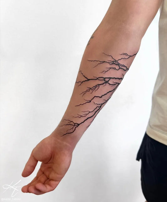 Medium Blackwork Lightning Branches Tattoo on Men Arm by @kelsi_tattoo