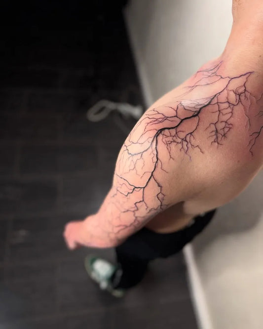 Medium Blackwork Lightning Branches Tattoo on Men Arm by @lcatattoo