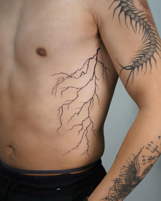 Medium Blackwork Lightning Branches Tattoo on Men Torso by @baronart_alan