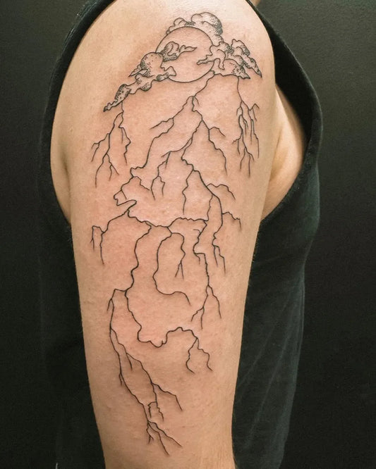 Medium Blackwork Lightning Clouds Tattoo on Men Shoulder by @hybridink.helsinki