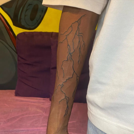 Medium Blackwork Lightning Tattoo on Men Arm by @kora.tattooist
