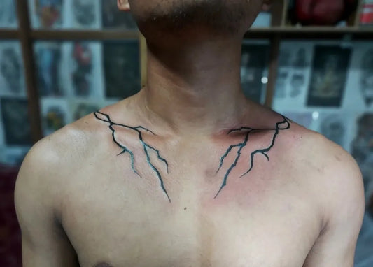 Medium Blackwork Lightning Tattoo on Men Chest by @benjamintonsing_tattoo_art