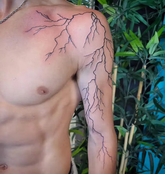 Medium Blackwork Lightning Tattoo on Men Shoulder by @funeral_wife