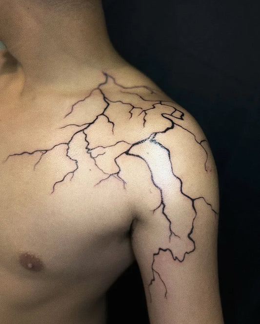 Medium Blackwork Lightning Tattoo on Men Shoulder by @inkdevourer_ny