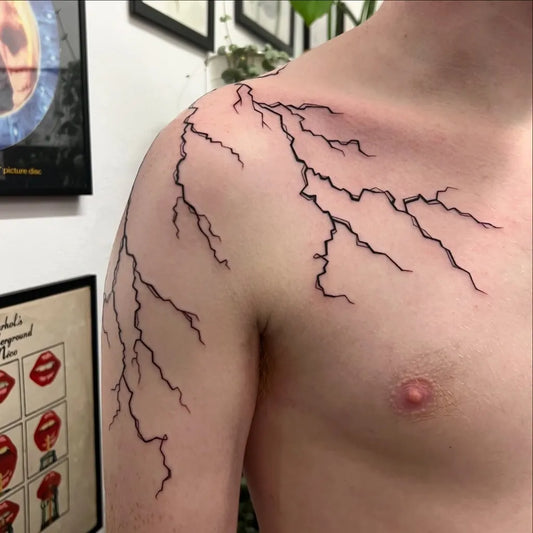 Medium Blackwork Lightning Tattoo on Men Shoulder by @inksmoke