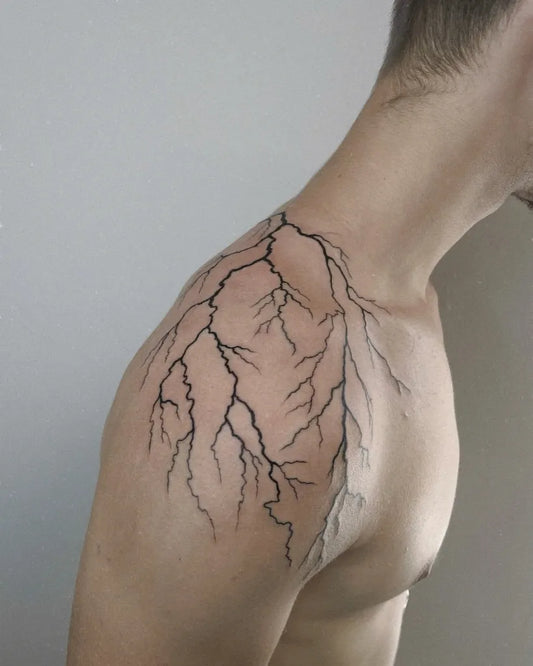 Medium Blackwork Lightning Tattoo on Men Shoulder by @krista_ink