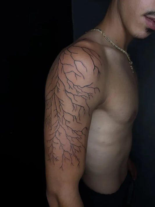 Medium Blackwork Lightning Tattoo on Men Shoulder by @mariochaayatattoos