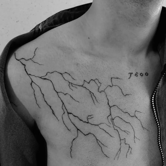 Medium Blackwork Lightning Tattoo on Men Shoulder by @soheiljodati.art
