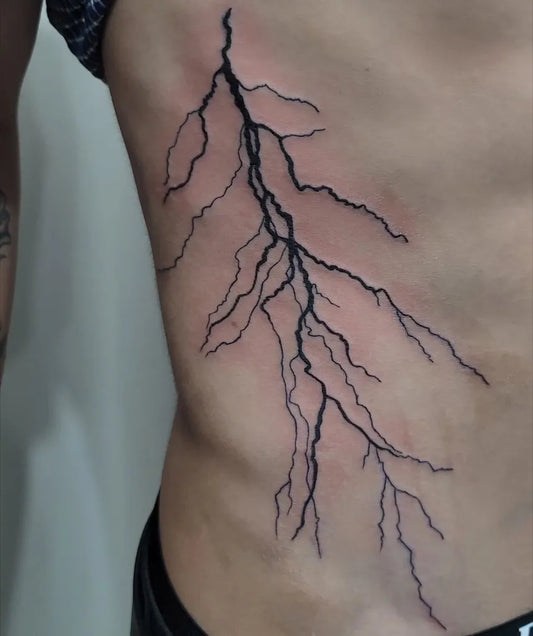Medium Blackwork Lightning Tattoo on Men Torso by @sofycalathea_tattoo