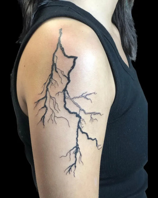 Medium Blackwork Lightning Tattoo on Women Shoulder by @expressiveinknj