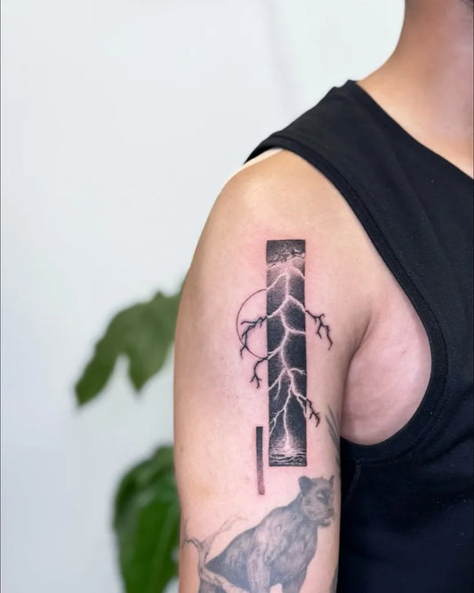 Medium Blackwork Lightning and Dog Tattoo on Men Shoulder by @inkedbylily