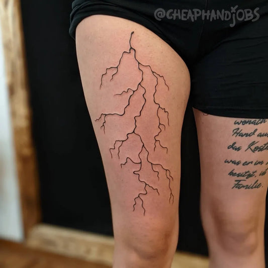 Medium Blackwork Lightning and Script Tattoo on Women Thigh by @cheaphandjobs