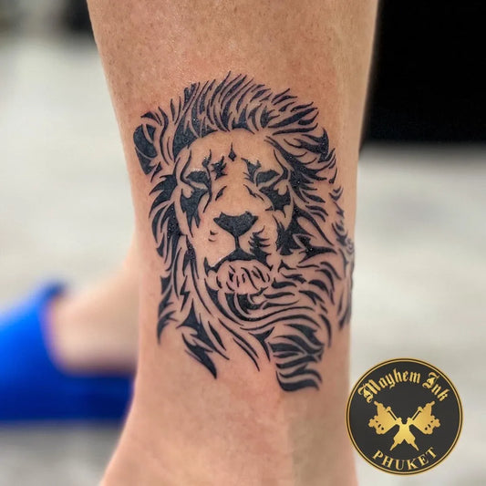 Medium Blackwork Lion on Women Ankle Tattoo by @mayheminktattoo