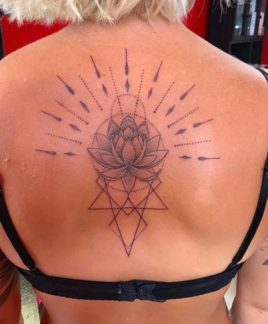 Medium Blackwork Lotus Flower with Geometric Mandala on Women Back Tattoo by @puertotattoostudio