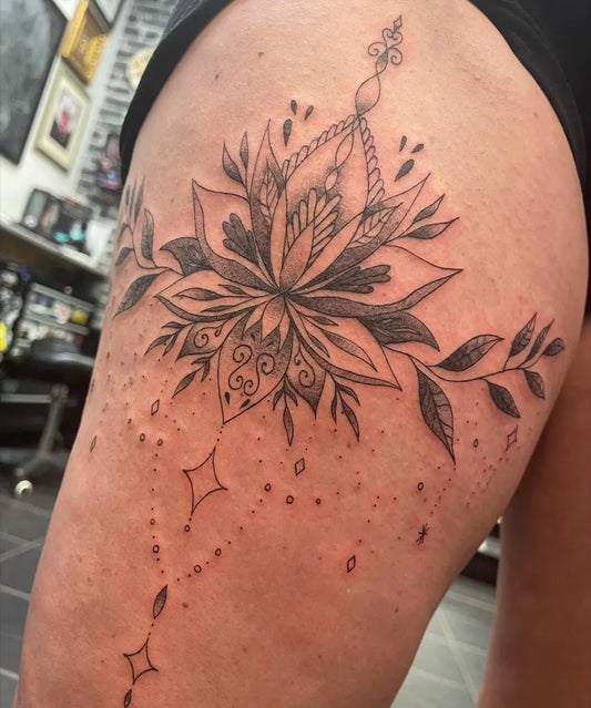 Medium Blackwork Lotus Flower with Mandala and Vines on Women Thigh Tattoo by @smileycharrtattooz
