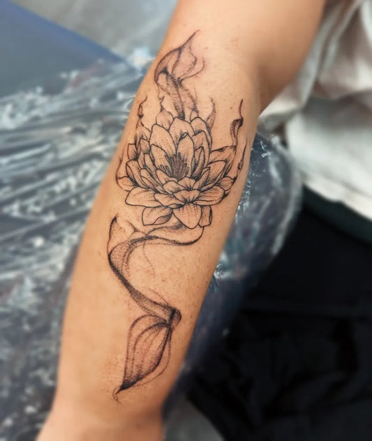 Medium Blackwork Lotus Flower with Smoke on Women Arm Tattoo by @lauryn.ink