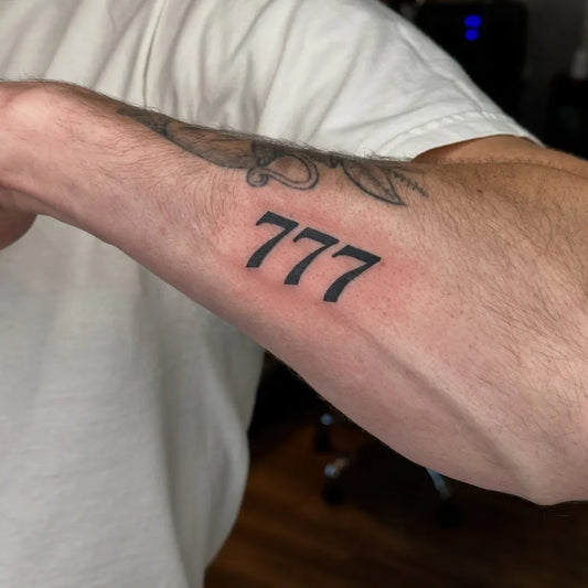 Medium Blackwork Lucky Number 777 Tattoo on Men Arm by @_inkbypineda