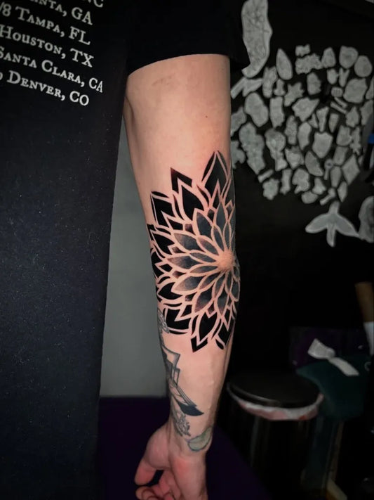 Medium Blackwork Mandala Tattoo on Men Elbow by @odinsontattoos