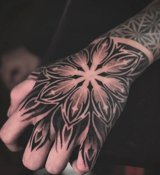 Medium Blackwork Mandala Tattoo on Men Hand by @lamanigancetattootoronto