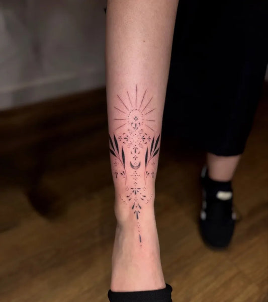 Medium Blackwork Mandala and Sun Tattoo on Women Leg by @ao31nk