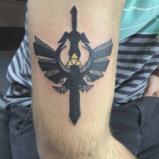 Medium Blackwork Master Sword Tattoo on Men Bicep by @_lydiathetattoolady