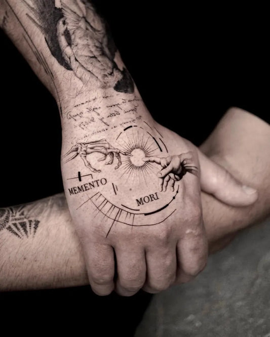 Medium Blackwork Memento Mori Hands Sun on Men Hand Tattoo by @architex_tattoo