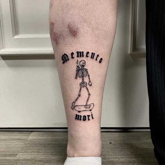 Medium Blackwork Memento Mori Skeleton Skateboard on Men Leg Tattoo by @somestattoo