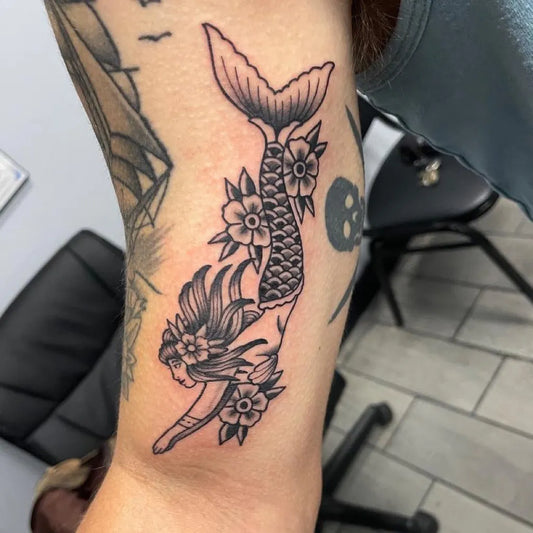 Medium Blackwork Mermaid Flowers Tattoo on Women Arm by @atsjacksonville