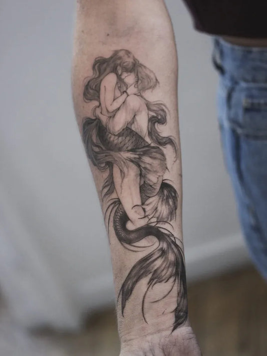 Medium Blackwork Mermaid Tattoo on Women Arm by @agatheoceane
