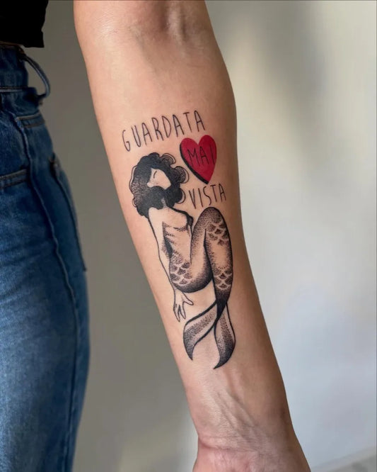 Medium Blackwork Mermaid and Heart Tattoo on Women Arm by @haavelila