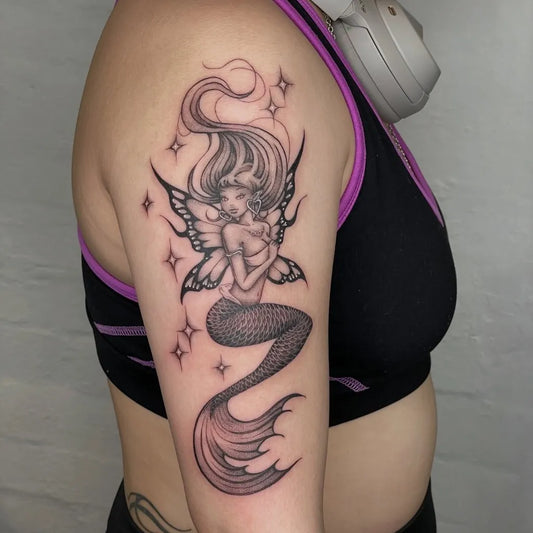 Medium Blackwork Mermaid with Wings Tattoo on Women Shoulder by @miss_preciouss