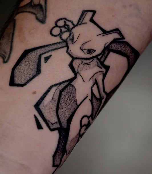 Medium Blackwork Mew Pokemon Tattoo on Women Arm by @gary.tattooer