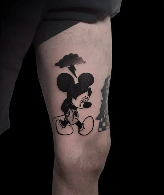 Medium Blackwork Mickey Mouse with Lightning Tattoo on Men Thigh by @athens_tattoo_studio