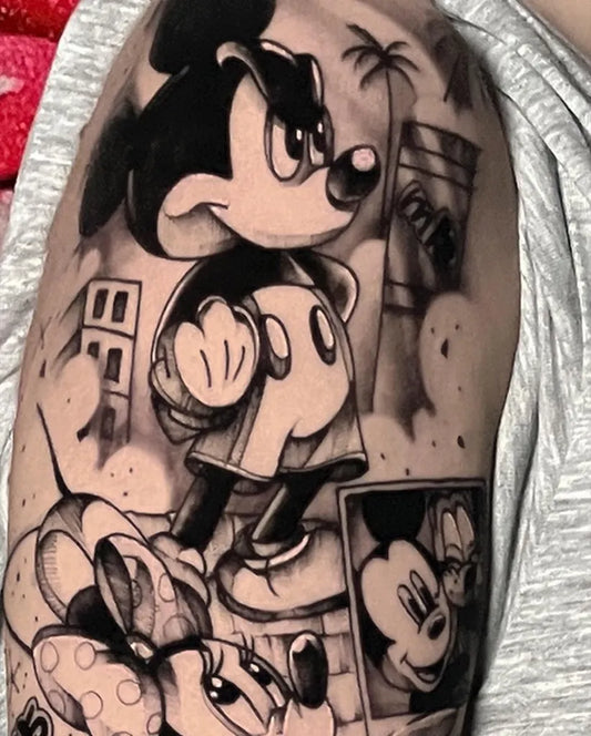 Medium Blackwork Mickey and Minnie Mouse Cartoon Tattoo on Men Arm by @jrocktattoo