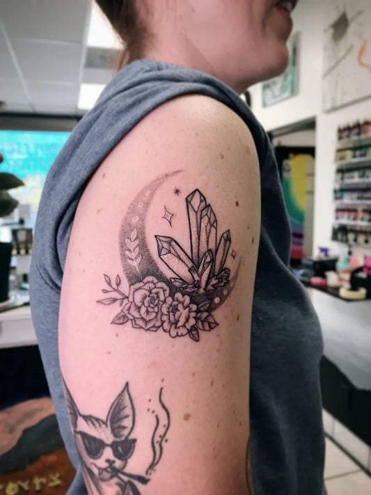 Medium Blackwork Moon Crystals Roses Tattoo on Women Arm by @odyssey.tattoo