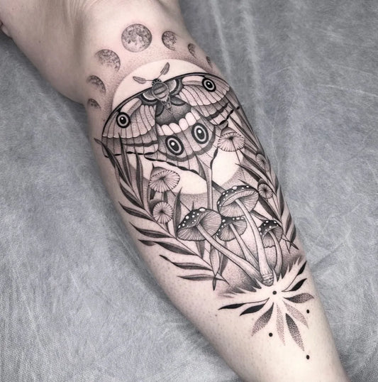Medium Blackwork Moon Phases Moth Mushrooms Tattoo on Women Thigh by @tattoosbyshannen.cass