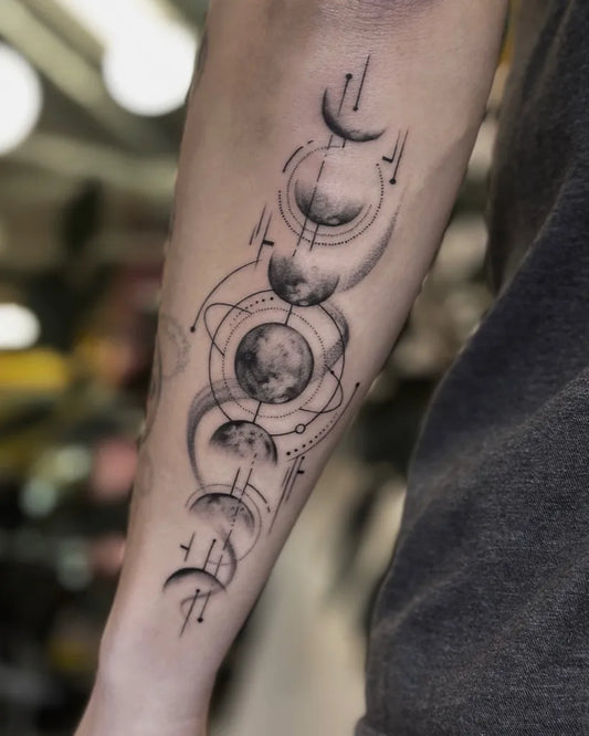 Medium Blackwork Moon Phases Orbit Tattoo on Men Arm by @wtf.jian.tattoo